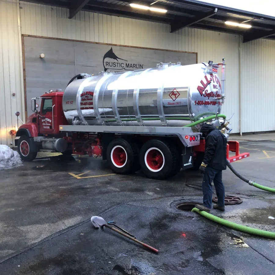 All-Town tanker truck pumping a commercial septic tank